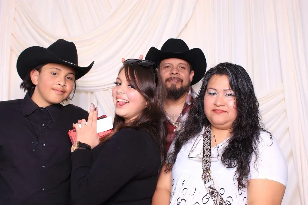 Family group laughing together in the Proof Of Party photo booth
